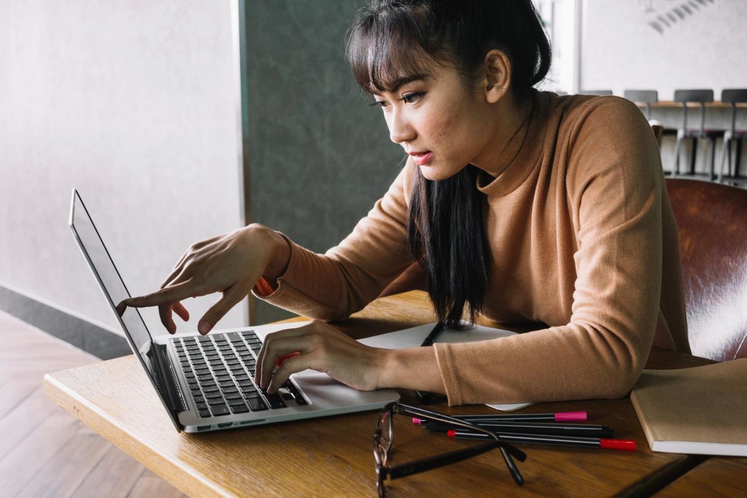 Students collaborating on network configuration in modern training facility